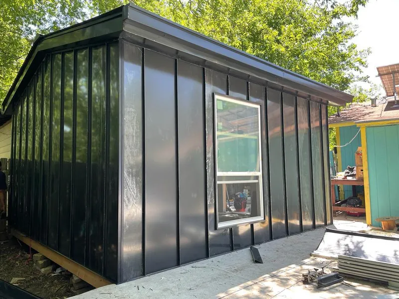 Black standing seam metal wall panels for Roof Inspection in Lago Vista