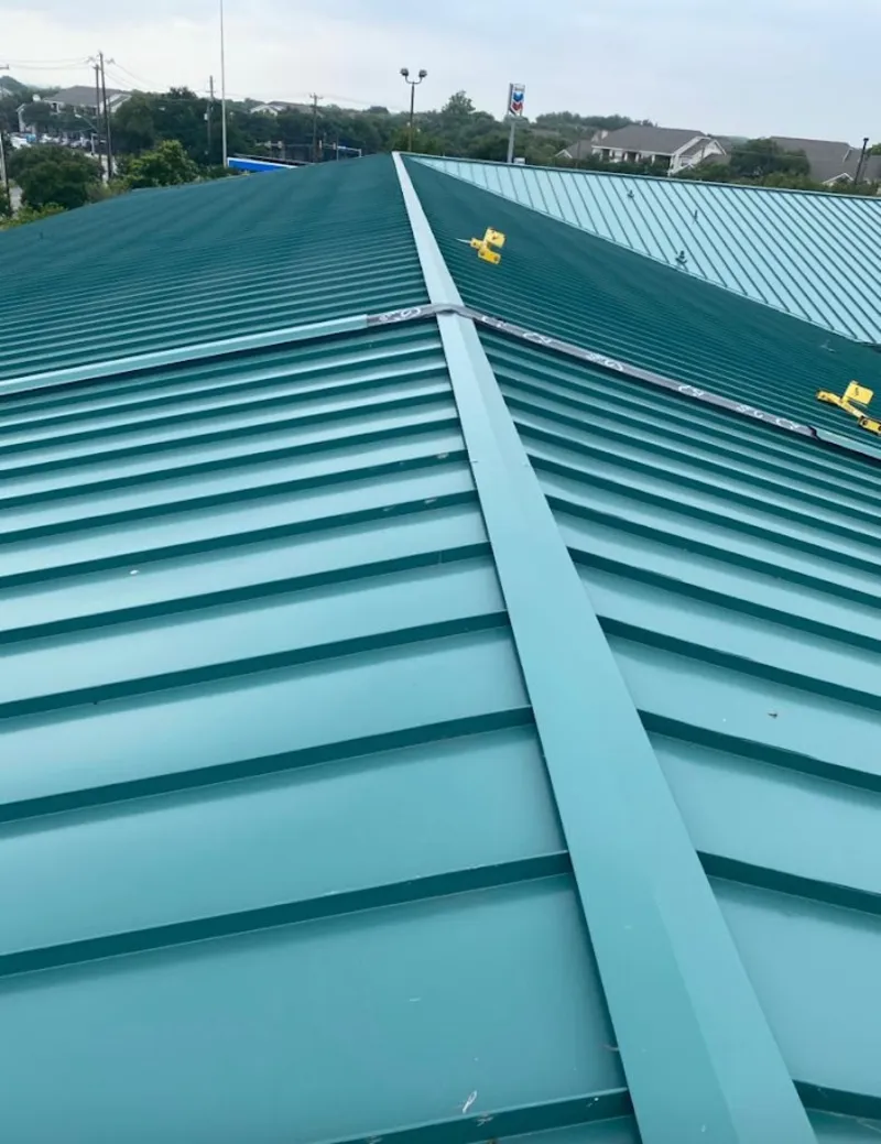 Green commercial metal roof ridge and valley for Metal Roof Repair in Lago Vista